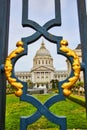 City hall and memorial court viewed through fancy black and golden gilded lamppost