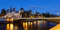 City Hall of Paris and bridge D'Arcole across Seine river at night, France. Royalty Free Stock Photo