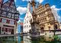 City Hall is reflected in the fountain Rothenburg ob der Tauber