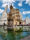 City Hall is reflected in the fountain Rothenburg ob der Tauber