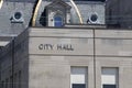 City Hall in silver text set against limestone bricks