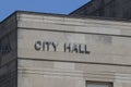 City Hall in silver text set against limestone bricks