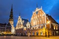 City Hall Square with House of the Blackheads and Saint Peter church in Old Town of Riga in the evening, Latvia Royalty Free Stock Photo