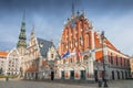 City Hall Square with House of the Blackheads and Saint Peter church in Old Town of Riga in the evening, Latvia Royalty Free Stock Photo