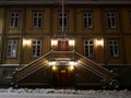 City hall of Tromso, north Norway at night in december - even the bicycle covered in snow Royalty Free Stock Photo