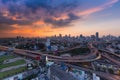 City highway interchanged with central business downtown backgroundAerial view Bangkok city background and highway intersection wi Royalty Free Stock Photo