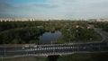 City highway. Overpass across the river. On the horizon at home. Aerial photography