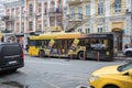 City, Kiev, Ukraine. City center with traffic and bus. Street with buildings and tourists
