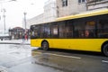 City, Kiev, Ukraine. City center with traffic and yellow bus. Street with buildings