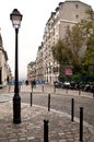 A city lamp in the corner of the street in Monmarte