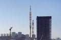 City landscape with construction cranes and skyscraper Royalty Free Stock Photo