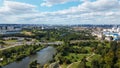 City landscape. Nearby there is a park area. Blue sky with white clouds. Aerial photography Royalty Free Stock Photo