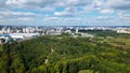 City landscape. Nearby there is a park area. Blue sky with white clouds. Aerial photography Royalty Free Stock Photo