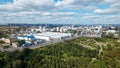 City landscape. Nearby there is a park area. Blue sky with white clouds. Aerial photography Royalty Free Stock Photo