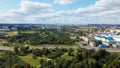 City landscape. Nearby there is a park area. Blue sky with white clouds. Aerial photography Royalty Free Stock Photo