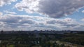 City landscape. Nearby there is a park area. Blue sky with white clouds. Aerial photography Royalty Free Stock Photo