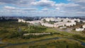 City landscape. Nearby there is a park area. Blue sky with white clouds. Aerial photography Royalty Free Stock Photo