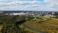 City landscape. Nearby there is a park area. Blue sky with white clouds. Aerial photography Royalty Free Stock Photo