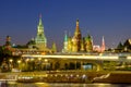 City landscape with night view on soaring bridge in Zaryadye and Red Square in Moscow Royalty Free Stock Photo