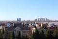 City landscape. The roofs of the houses are visible against the blue clear sky