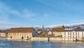 City landscape with a small town in Switzerland and mountains in the background.