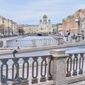 Citycape of St. Petersburg, Russia. View of Griboyedov canal, embankment and St. Isidor's Church.