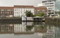 City landscape. Sunset on the embankment after rain