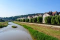 City landscape with Tarnava Mare River and blocks of flats in the center of Sighisoara, in Transylvania (Transilvania) Royalty Free Stock Photo