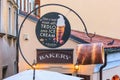 City landscape - view of the signboard of a cafe baking traditional Czech spit cake called Trdelnik or Trdlo