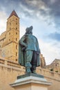 City landscape - view of the statue of d`Artagnan on the background of the tower of d`Armagnac, the town of Auch Royalty Free Stock Photo