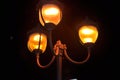 City lantern with three light bulb in the night Royalty Free Stock Photo