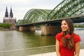 City life girl with headphone and red t-shirt enjoy her spare time in Cologne, Germany