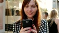 City Lifestye Portrait of Attractive Confident Woman Browing on Smart Phone