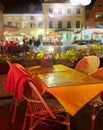 City night life  street cafe tables people dinner pink light on table Lifestyle Travel Restaurant City Light Old Town Tallinn , Royalty Free Stock Photo