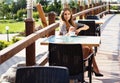 City lifestyle woman using smartphone on cafe