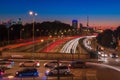 City light trails of fast moving car traffic on road in London at night Royalty Free Stock Photo