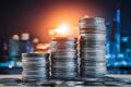 City lights behind towering coin stacks, symbolizing wealth and finance