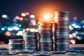 City lights behind towering coin stacks, symbolizing wealth and finance