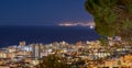 City lights of Cape Town at sunset from above with copy space. Panoramic coastal urban landscape at night. High angle Royalty Free Stock Photo