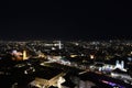 City lights of Graz and the famous clock tower Grazer Uhrturm on Shlossberg hill, Graz, Styria region, Austria, by night. Royalty Free Stock Photo