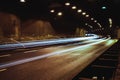 city lights long exposure street life in the city cars speed in a tunnel