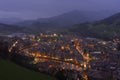 City lights at night with mountains background Royalty Free Stock Photo