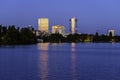 City lights reflecting at night over the water of Herastrau lake Royalty Free Stock Photo