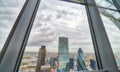 City of London framed by skyscraper window glasses Royalty Free Stock Photo