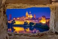 City of Mantova skyline evening view through stone window