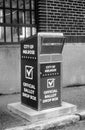 Official Ballot - Voting drop off box stands behind a post office