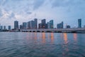 City of Miami Florida, sunset panorama with business and residential buildings and bridge on Biscayne Bay. Skyline night