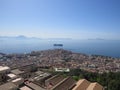 The city of Naples from above. Napoli. Italy. Vesuvius volcano behind.Orthodox church cross and the moon. Royalty Free Stock Photo