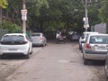 City Neighborhood Road Scene With Cars And Poles