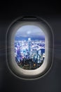 City at night through airplane window Royalty Free Stock Photo